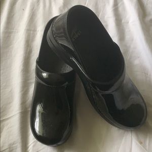 Dansko black patent clogs